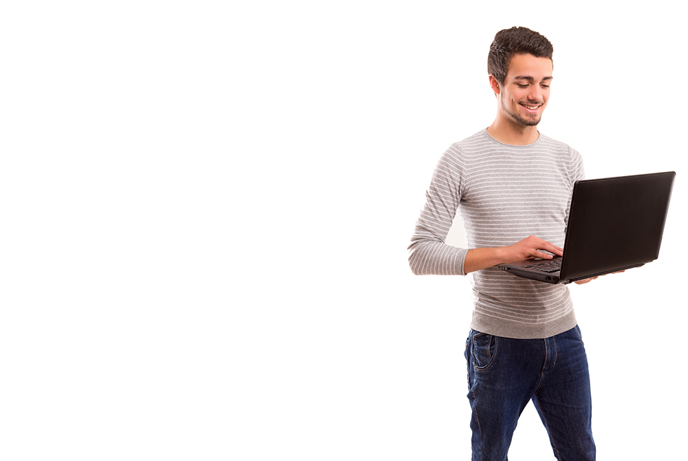 Young handsome man working with laptop computer